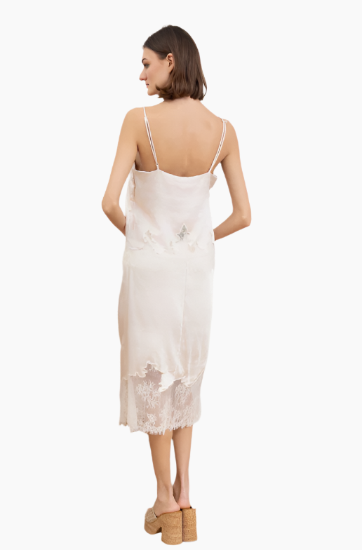 Woman wearing a white lace slip dress