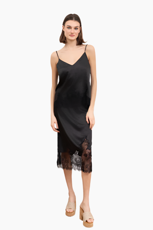 Woman wearing a black slip dress with lace