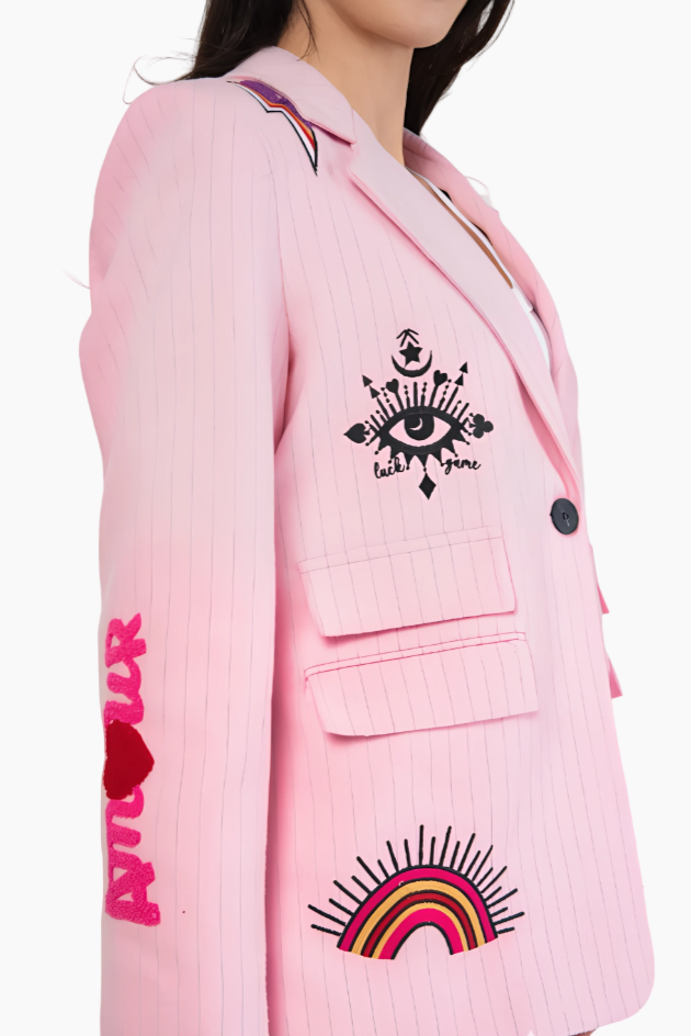 Pink blazer with eye and rainbow designs