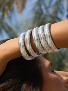 a set of silver statement bracelets