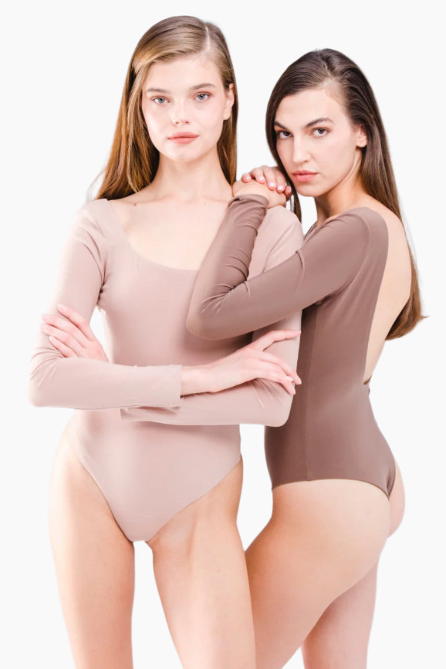 Two women wearing beige and brown bodysuits on a white background