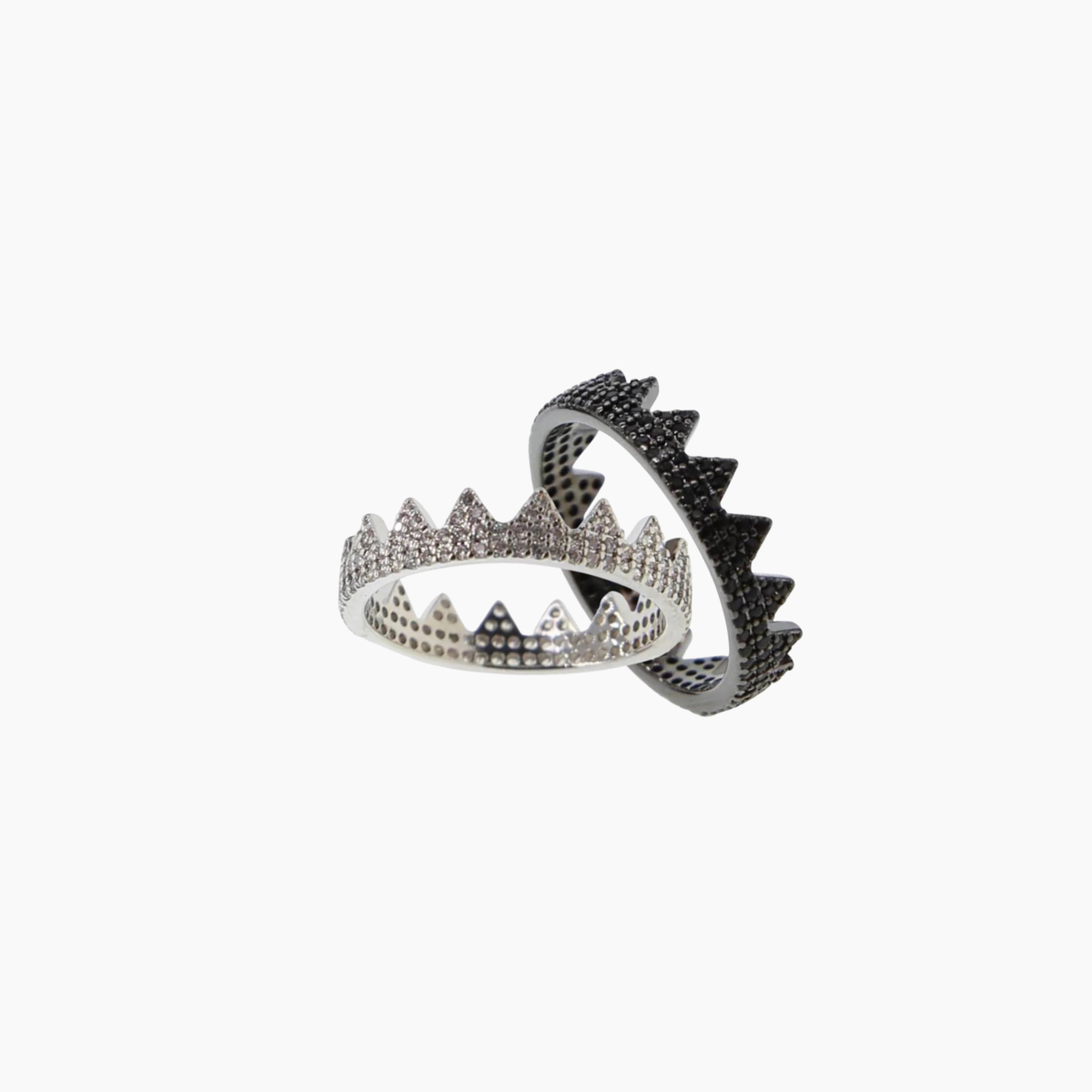 Silver crown-shaped ring on a white background