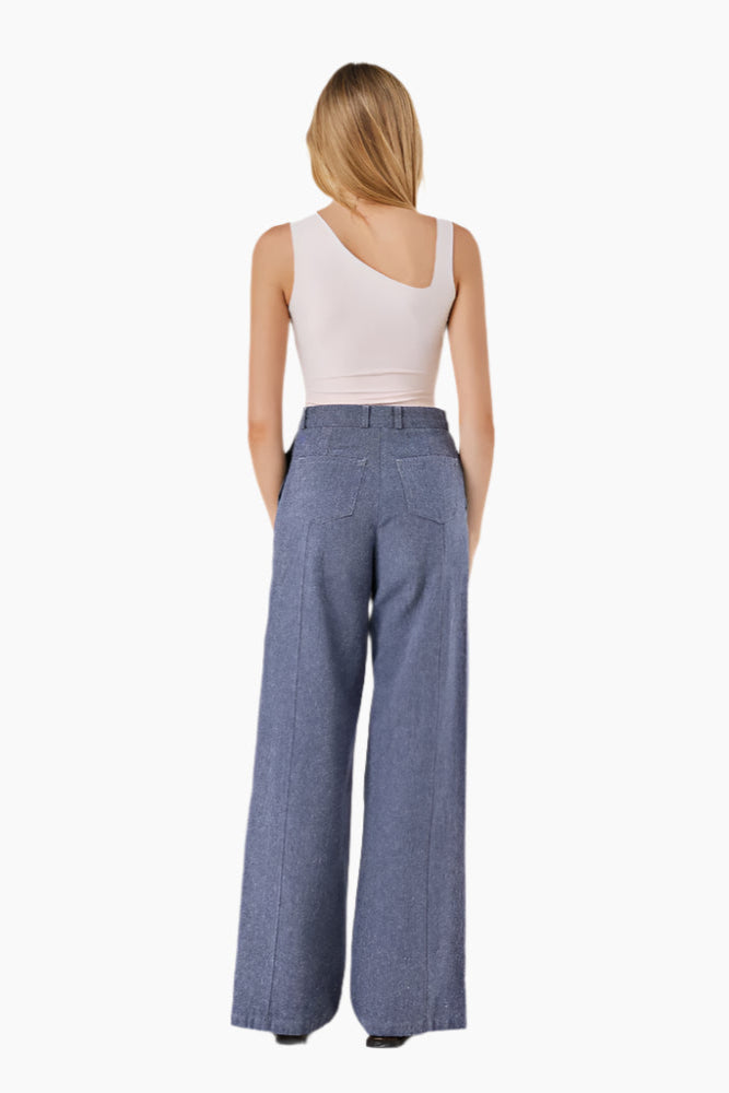 Fitted bodysuit with an asymmetrical neckline and snap button fastening at the bottom.