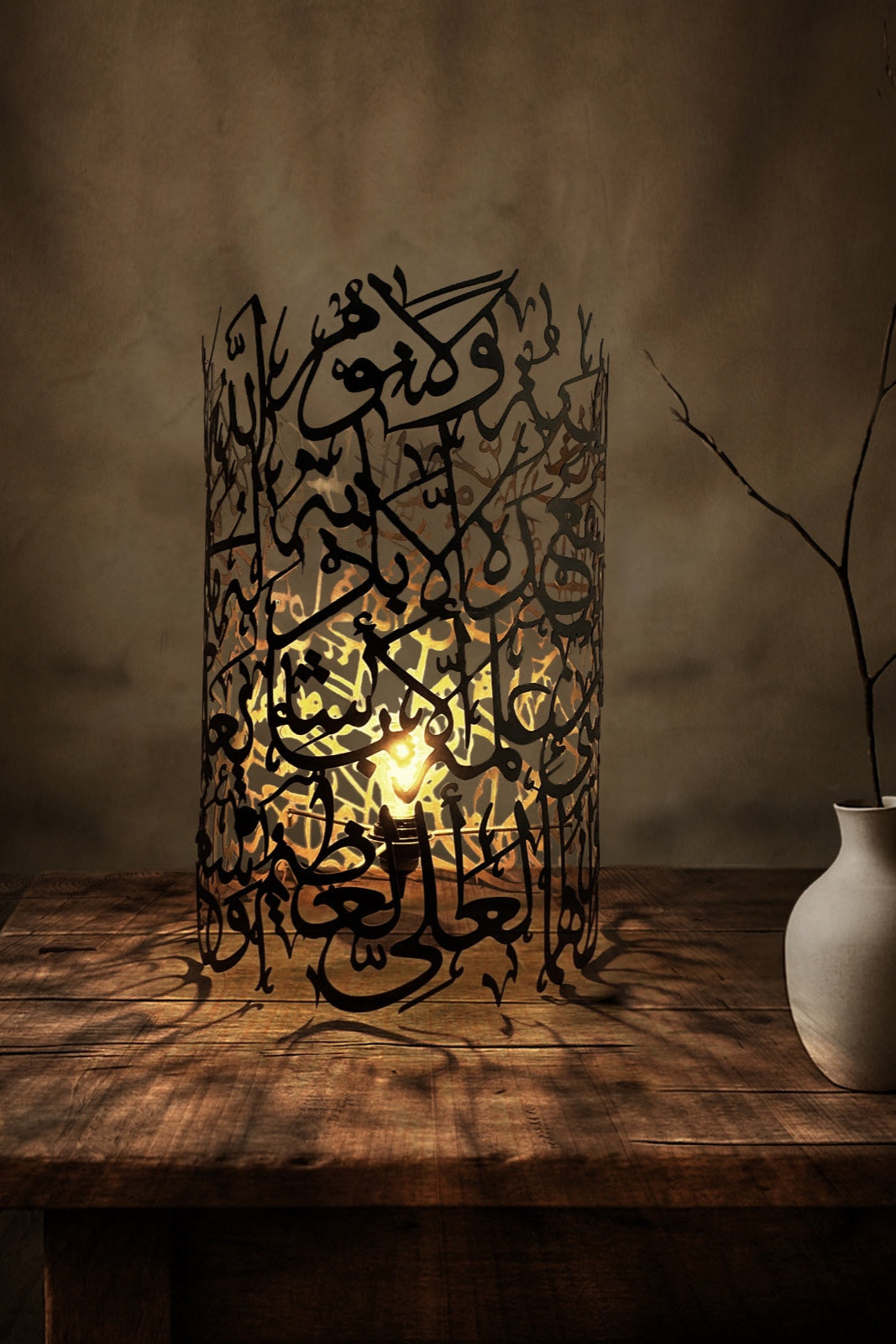 Decorative lamp with Arabic calligraphy on a wooden table
