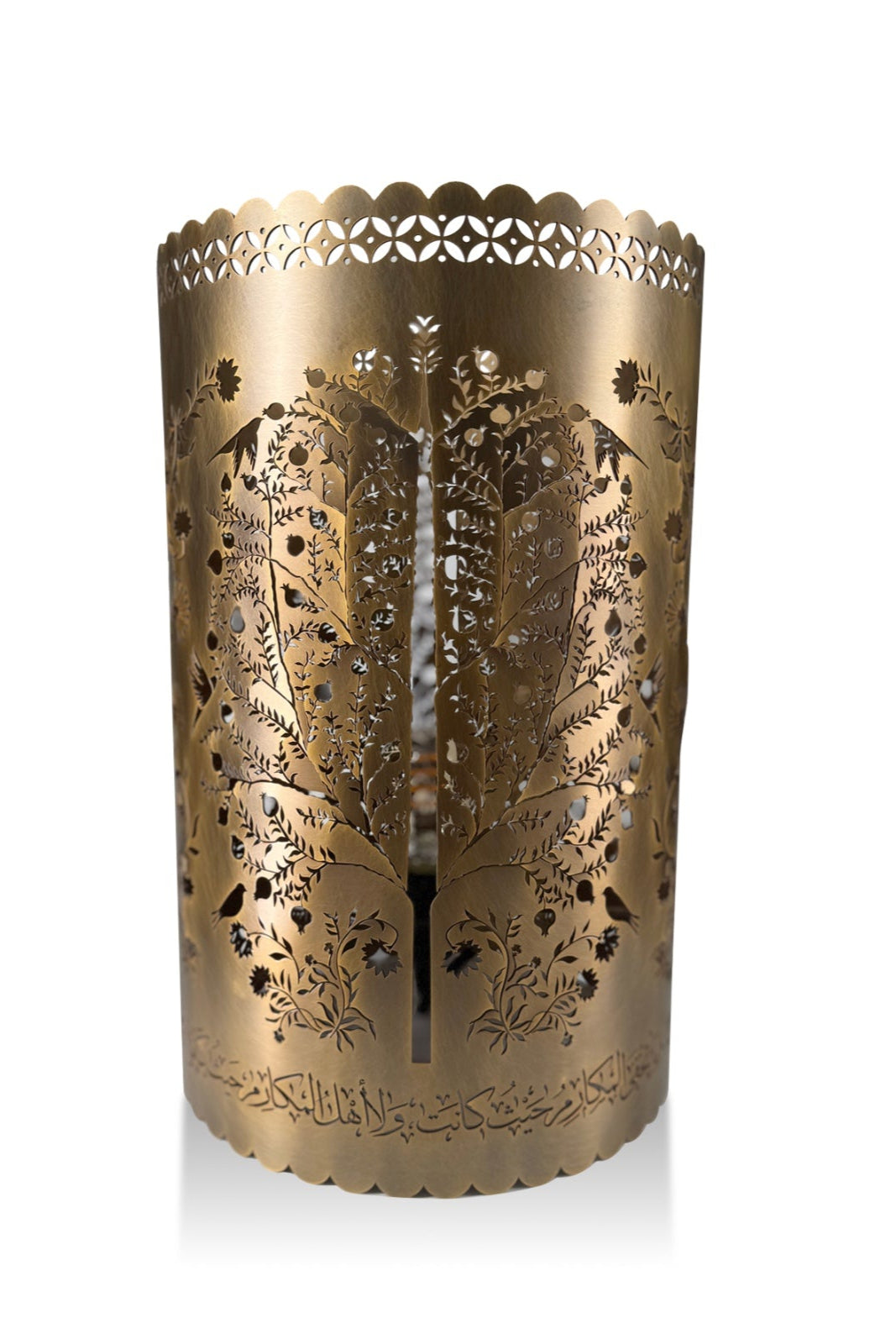 Decorative gold candle holder with intricate cut-out patterns on a white background