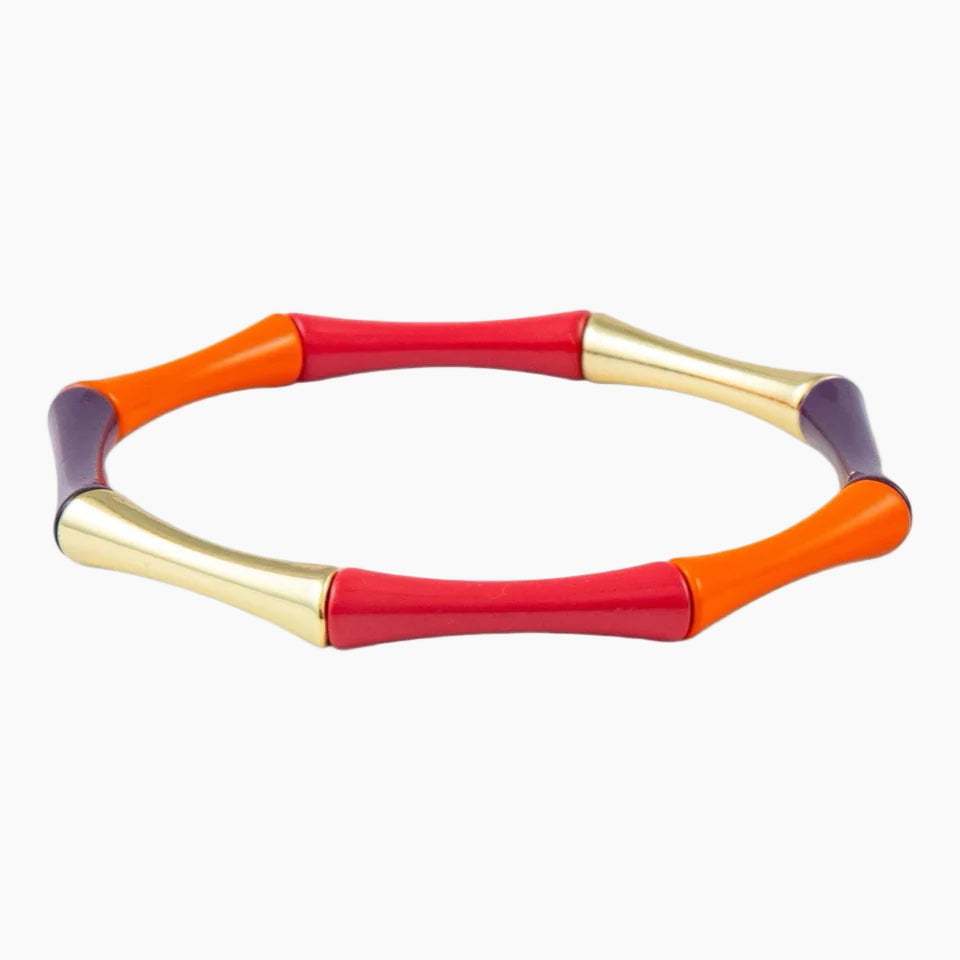Colorful necklace with red, orange, gold, and purple elements on a white background