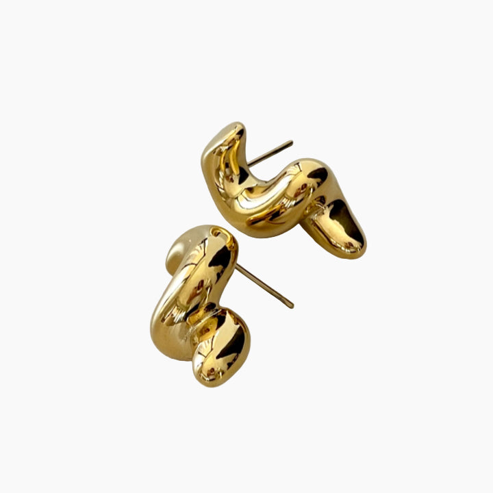 Gold hoop earrings on a white background