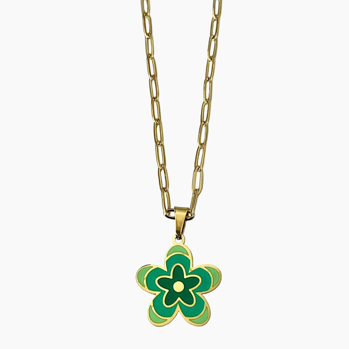 Gold necklace with a green flower pendant on a white background