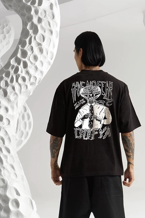 Person wearing a black t-shirt with a white graphic design on the back