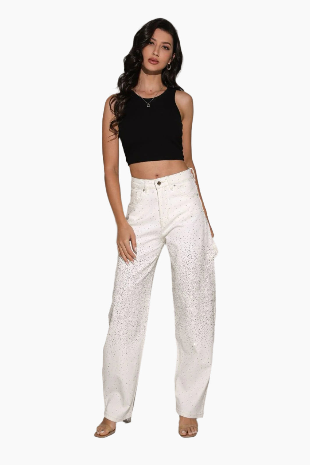 Woman wearing a black crop top and white pants
