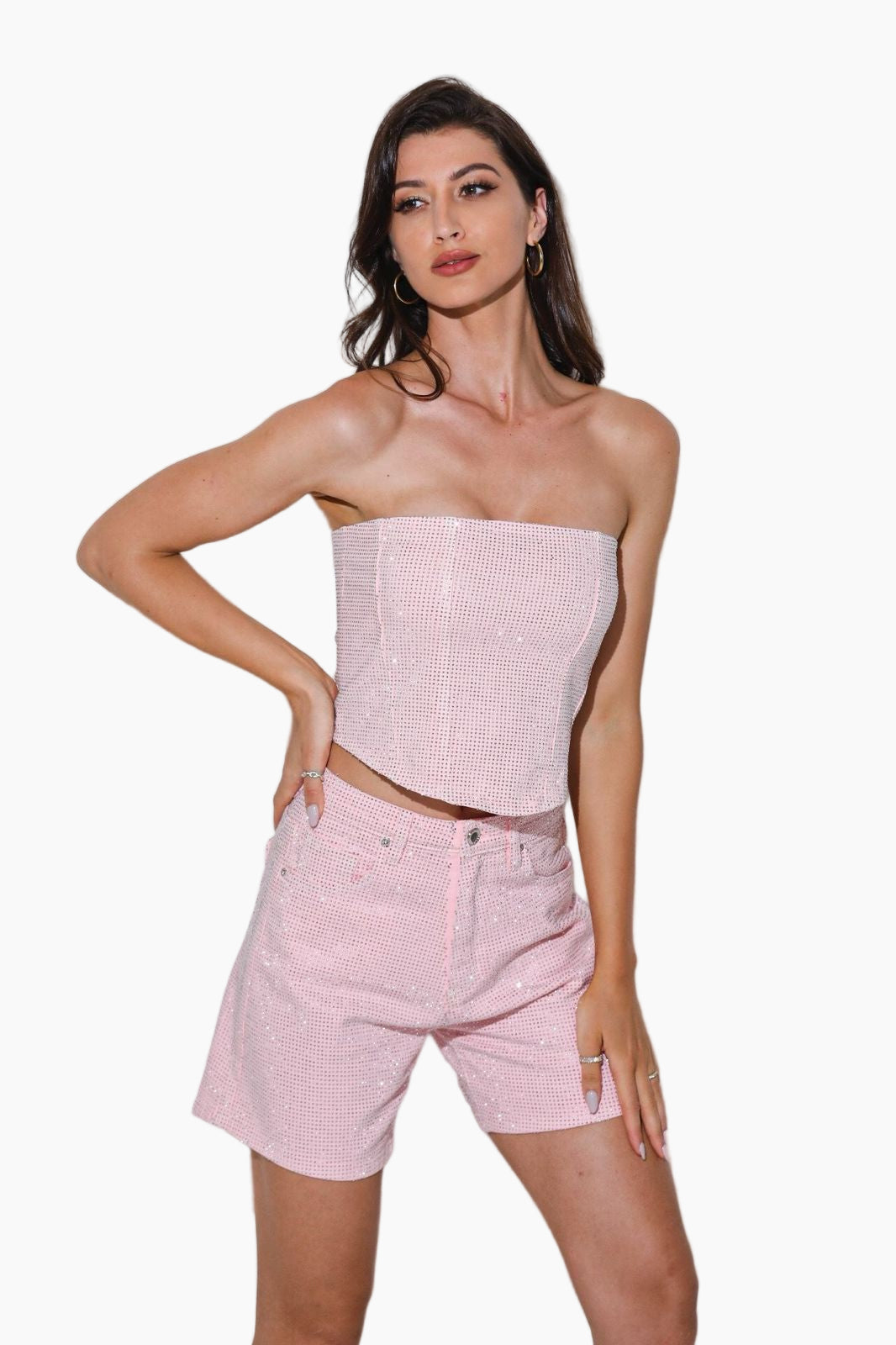 Woman wearing a strapless pink top and matching pants