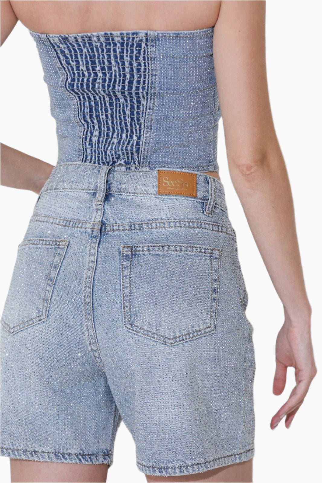 Denim strapless top and shorts with a visible brand label