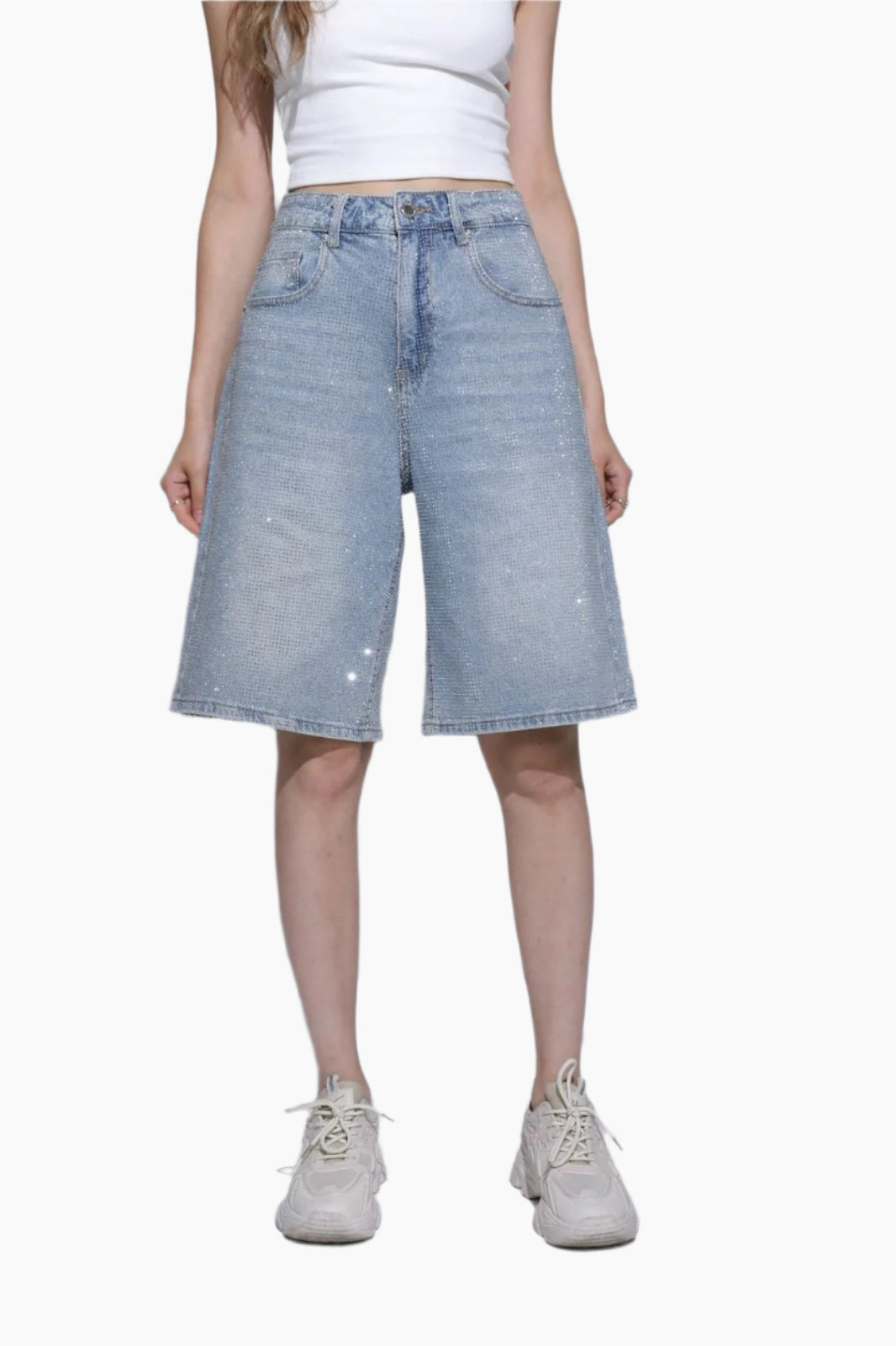 Person wearing light blue denim shorts