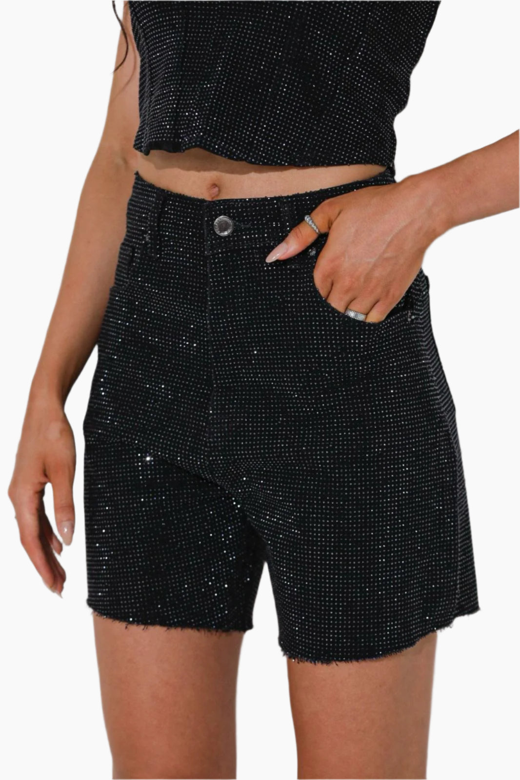 Person wearing black sequin shorts
