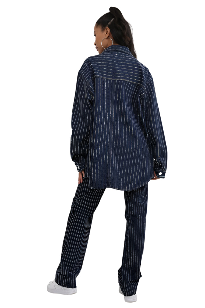 Person wearing a navy pinstripe outfit