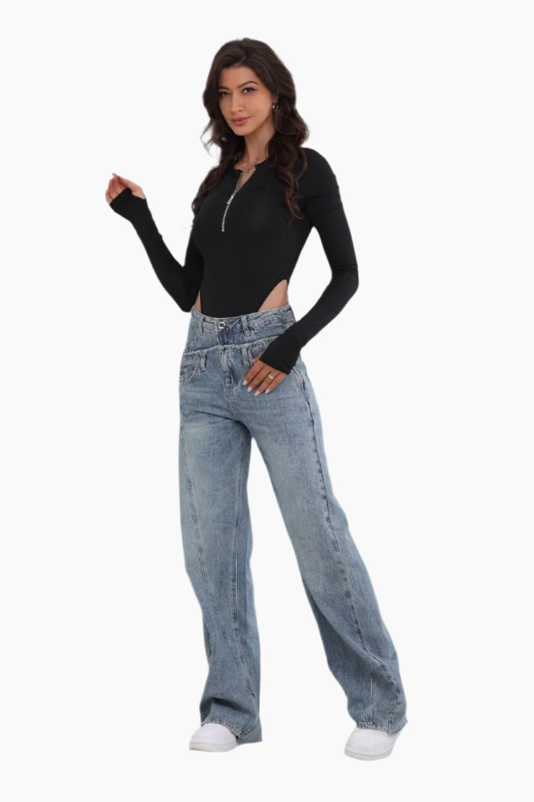 Woman wearing a black long-sleeve top and blue jeans