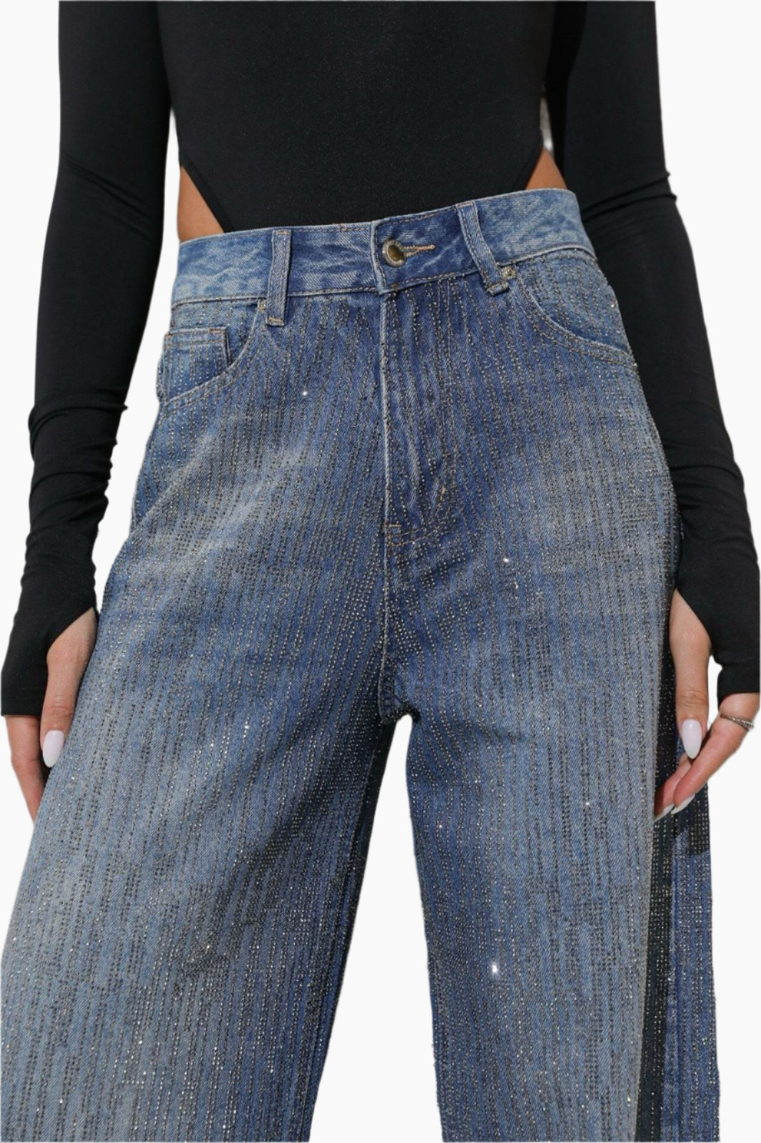 Blue jeans worn by a person with a black long-sleeve top