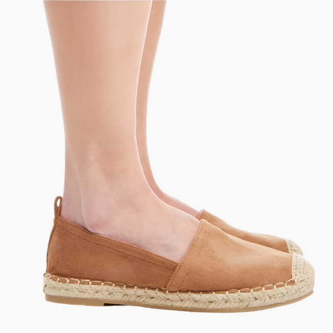 Tan espadrille shoe worn by a person
