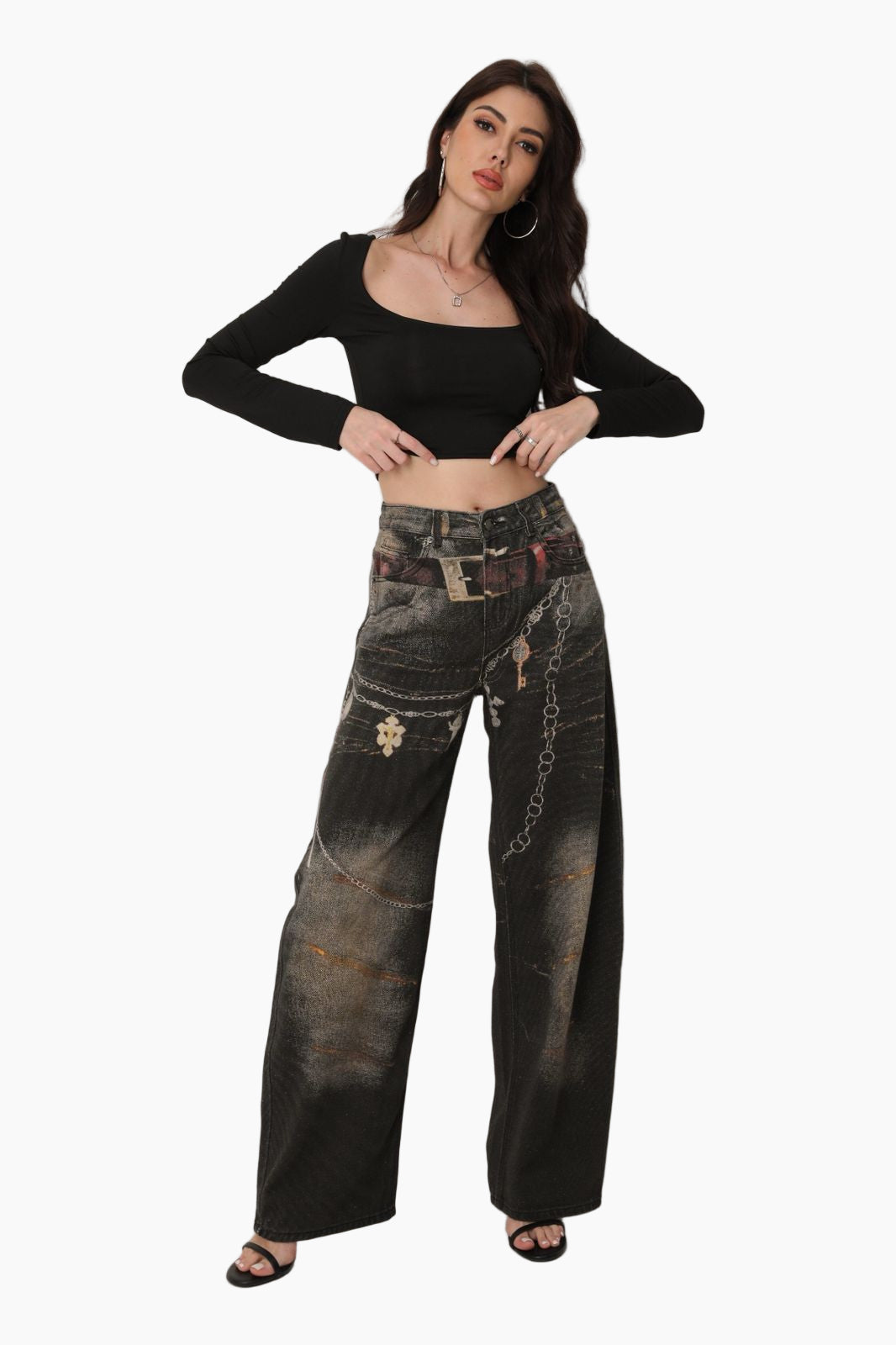 Woman wearing a black crop top and distressed black pants