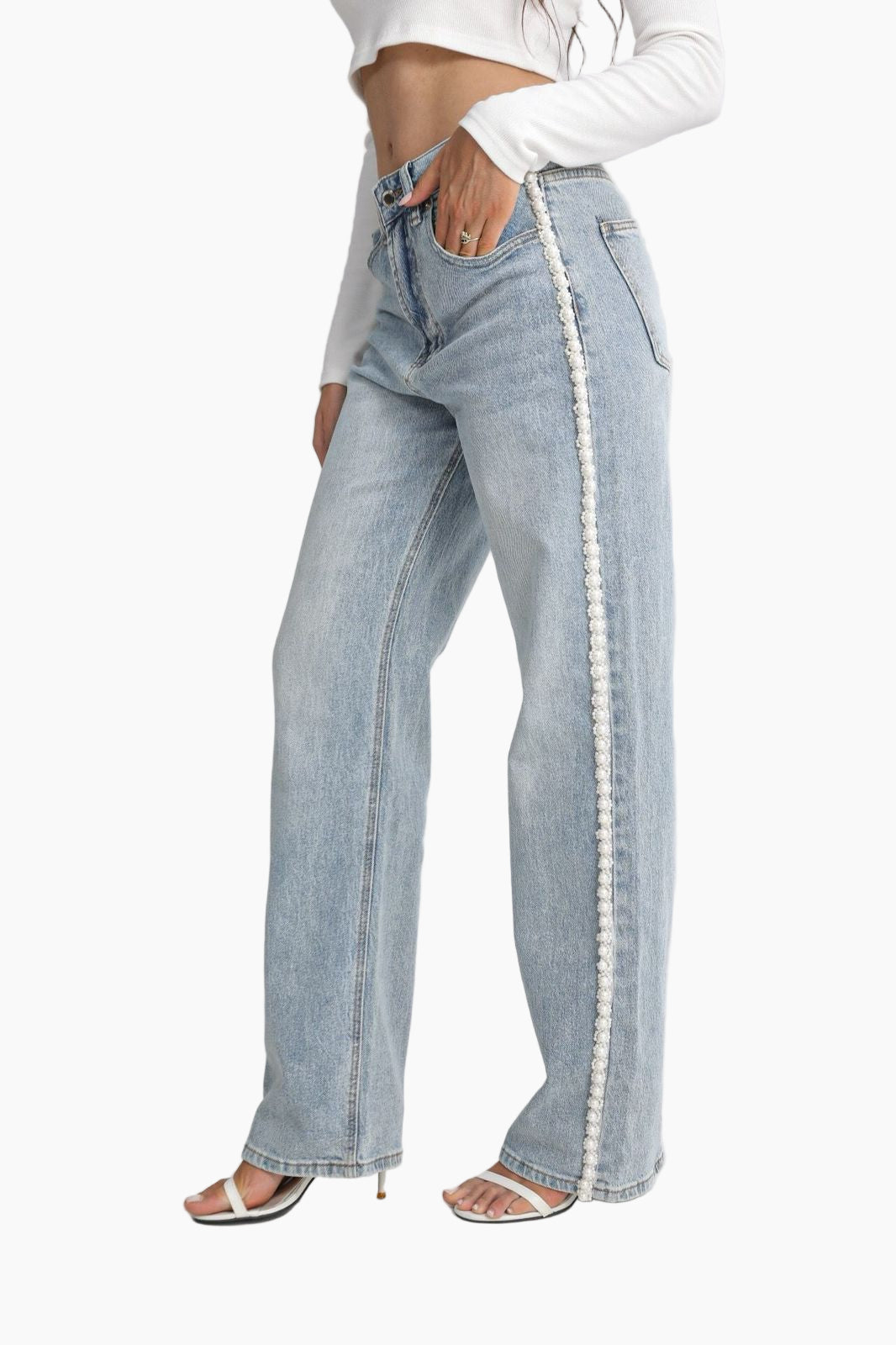 Light blue jeans with decorative trim