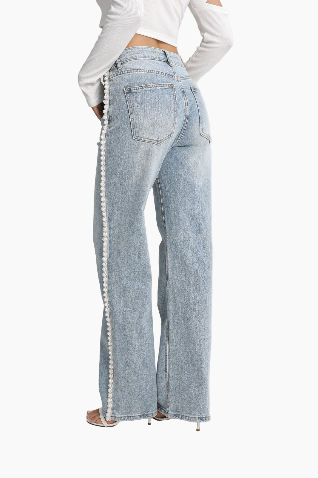 Light blue jeans with white trim worn by a person