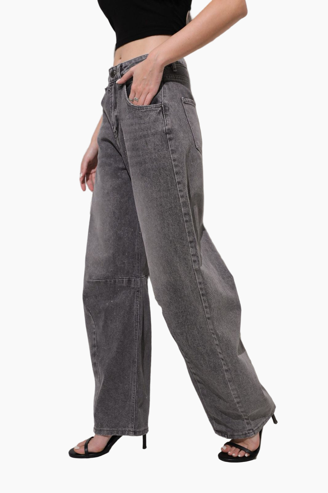Person wearing gray wide-leg jeans