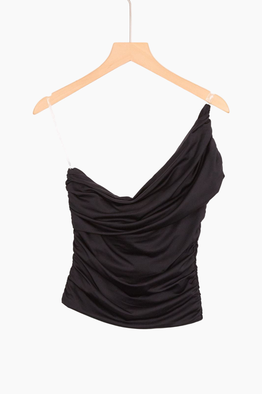 Black one-shoulder top on a hanger