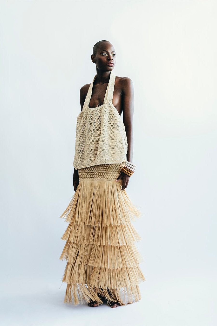 Woman wearing a beige layered dress