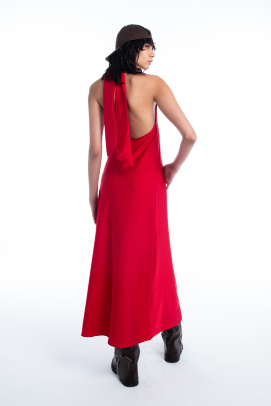 Woman wearing a red dress with a halter neck design