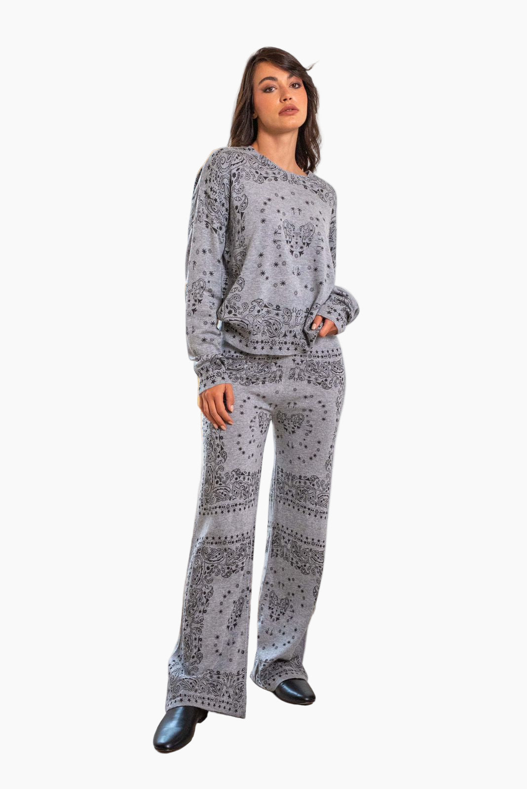 Woman wearing a patterned sweater and pants set