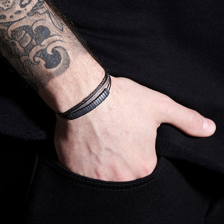 Handmade Sterling Silver 925 Bracelet with wax cord and hematite, consist of handmade braid with silver elements and a string of matt gray hematite.