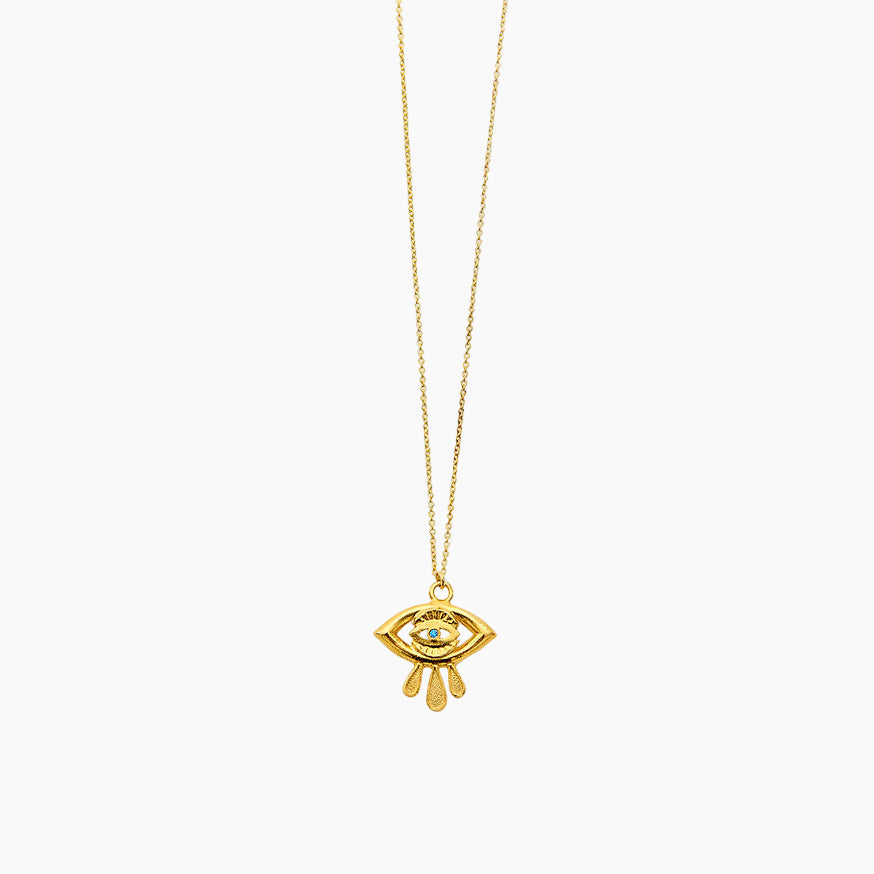Gold necklace with an eye-shaped pendant.