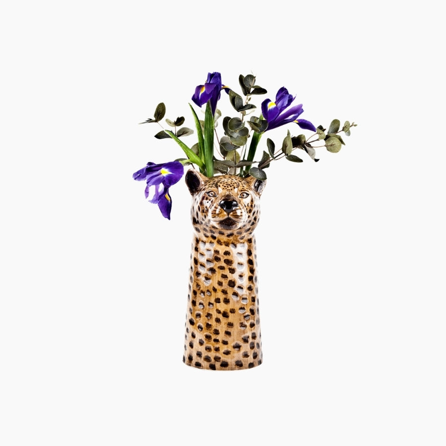 Vase shaped like a cheetah head with flowers
