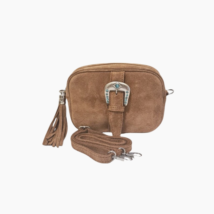 Brown suede handbag with a decorative buckle and tassel