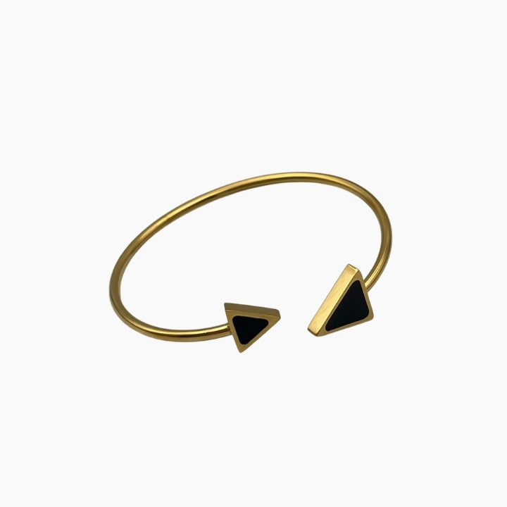 Gold bracelet with black triangle charms