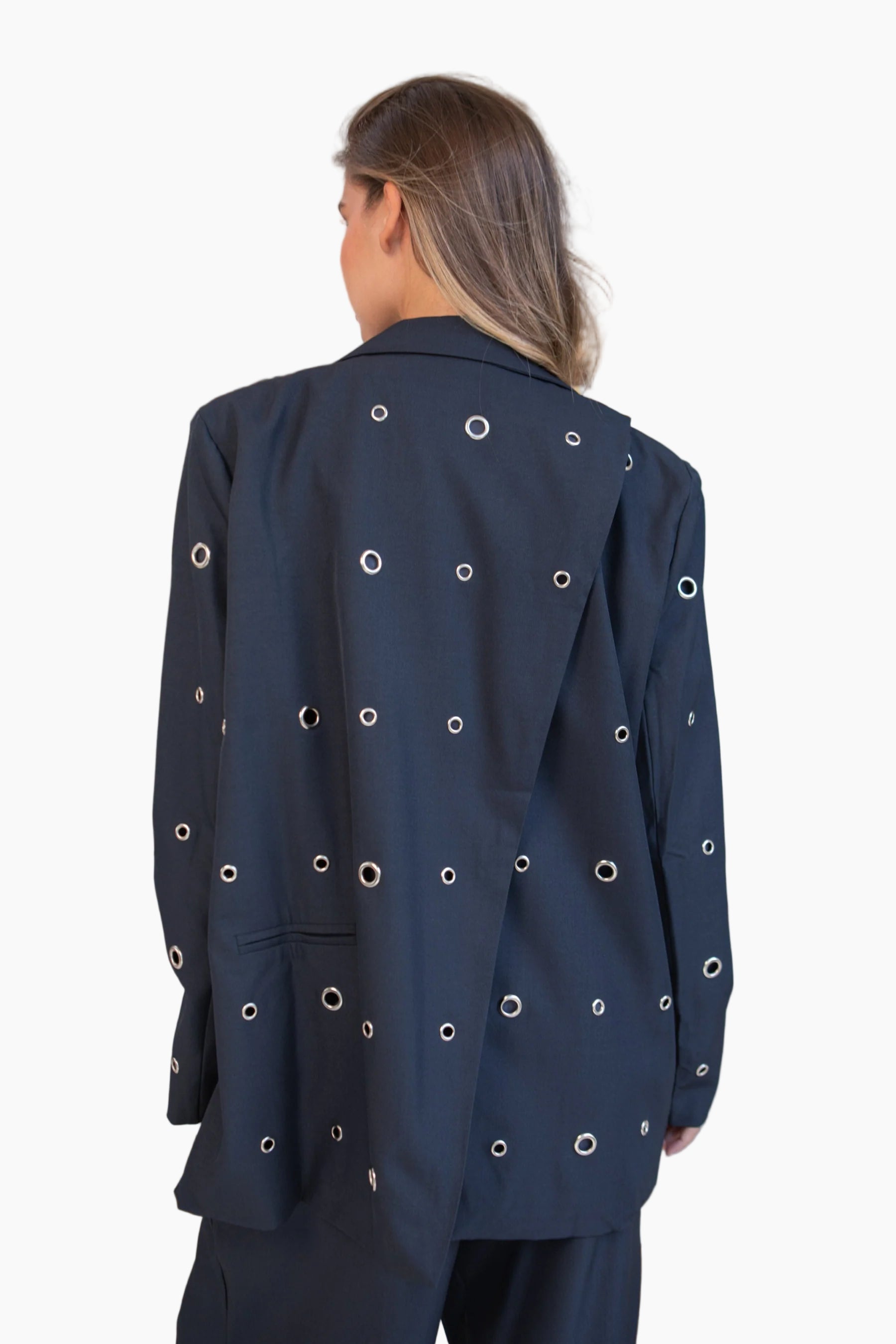 Navy blue jacket with circular cutouts