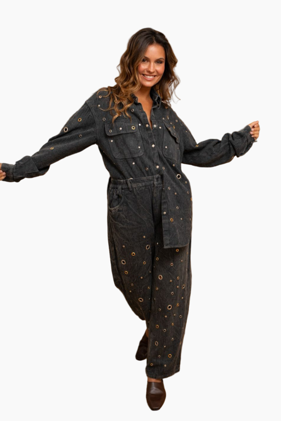 Woman wearing a black denim jumpsuit
