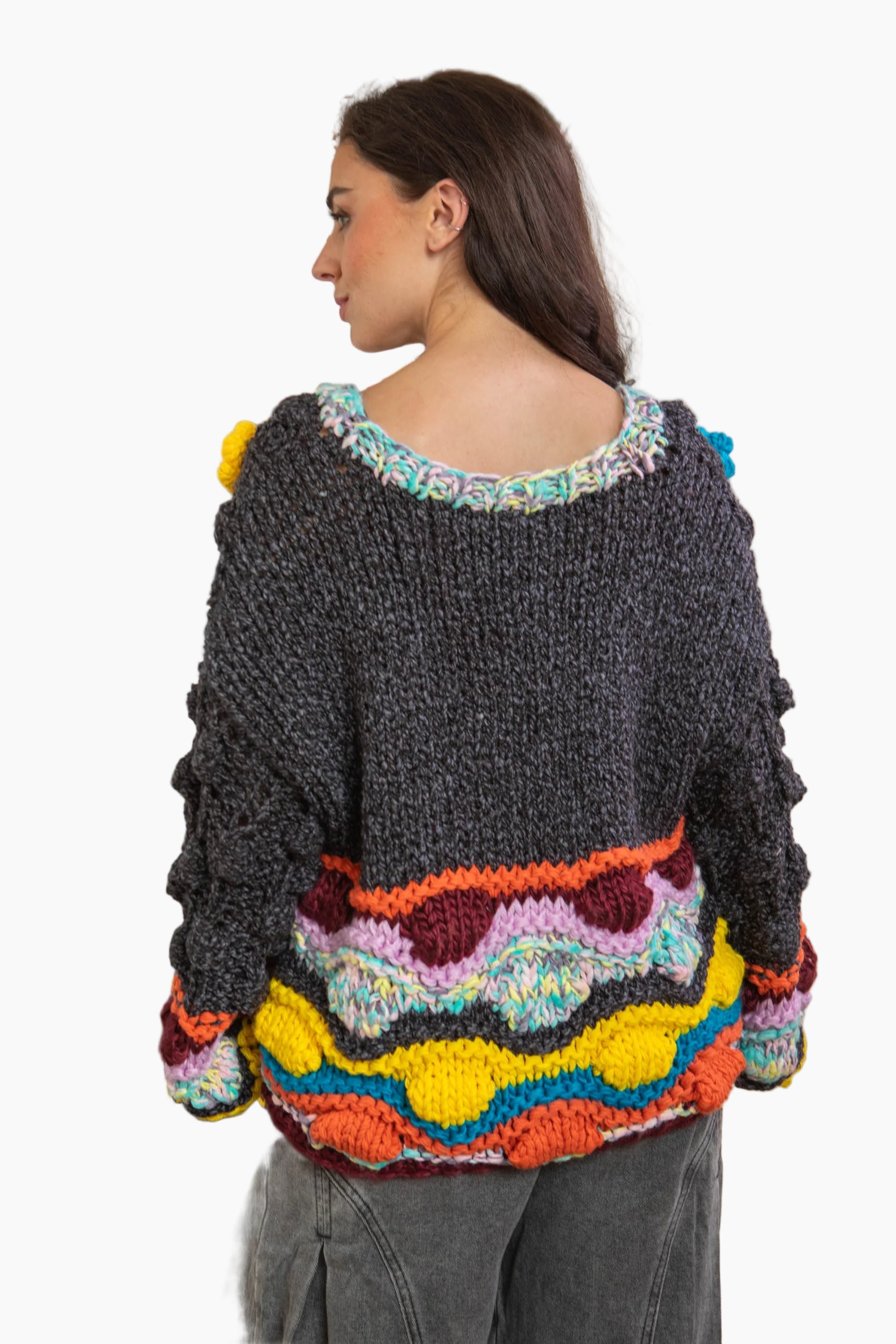 Woman wearing a colorful, patterned sweater