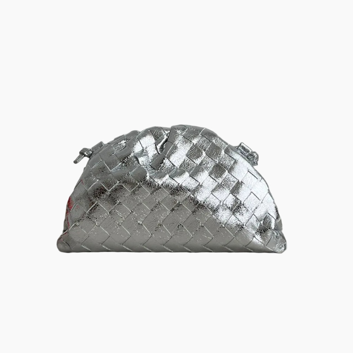 A metallic silver woven leather pouch with a diamond-patterned texture, resting on a light gray surface against a neutral gray background.