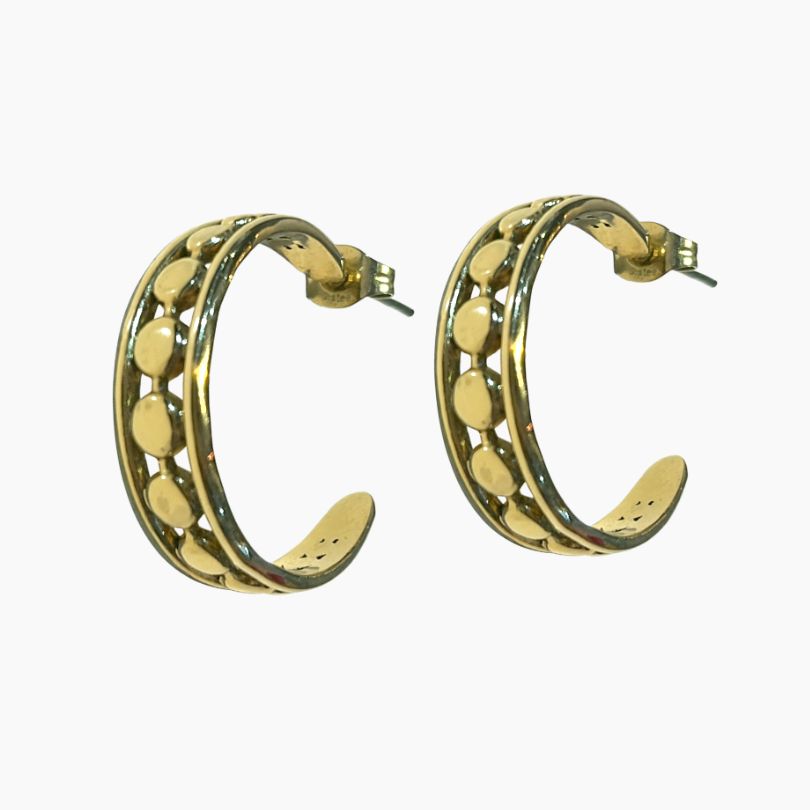 Gold hoop earrings with circular patterns