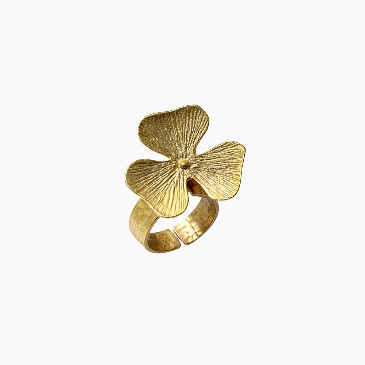 Gold ring with a leaf design on a white background