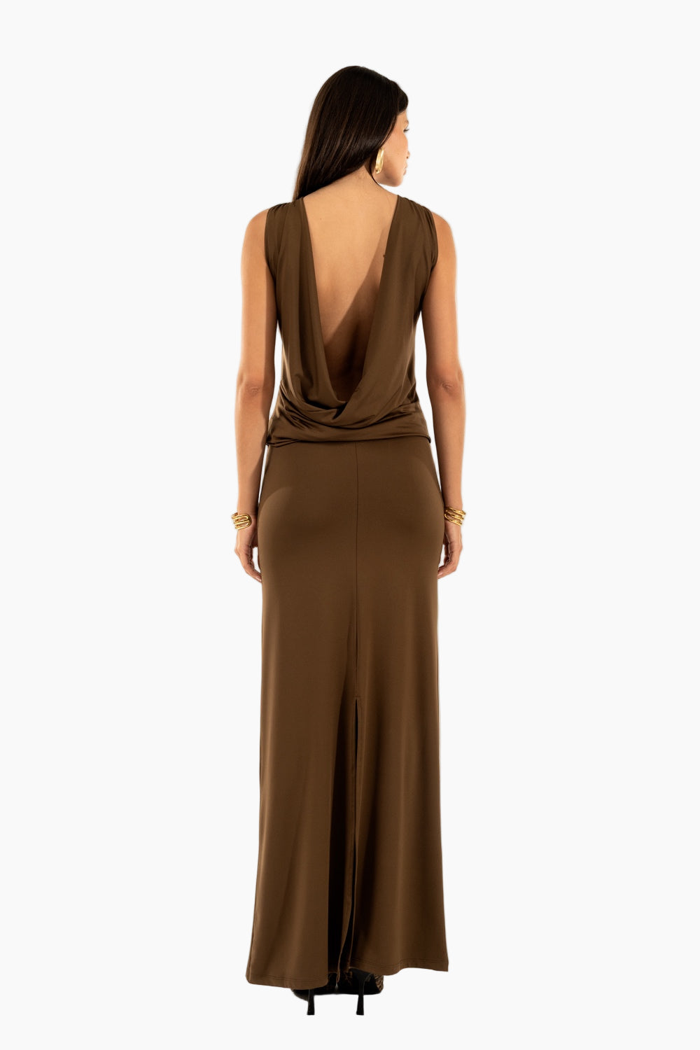 Woman wearing a brown evening gown with a plunging neckline