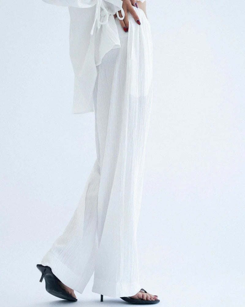 White pants worn with a black heel
