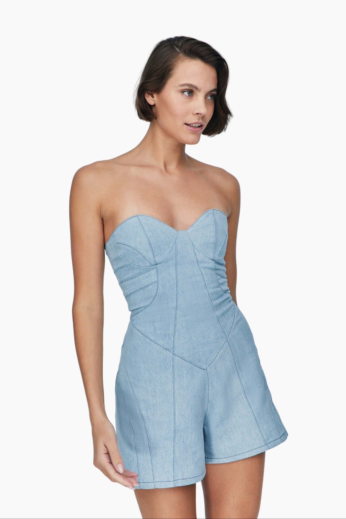 Woman wearing a light blue strapless romper