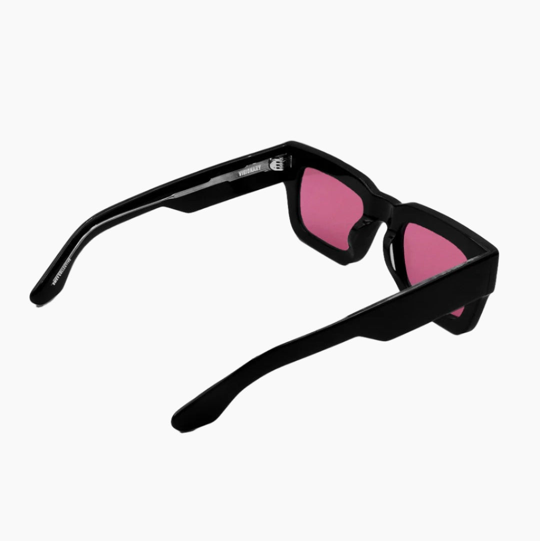 Black sunglasses with pink lenses on a white background