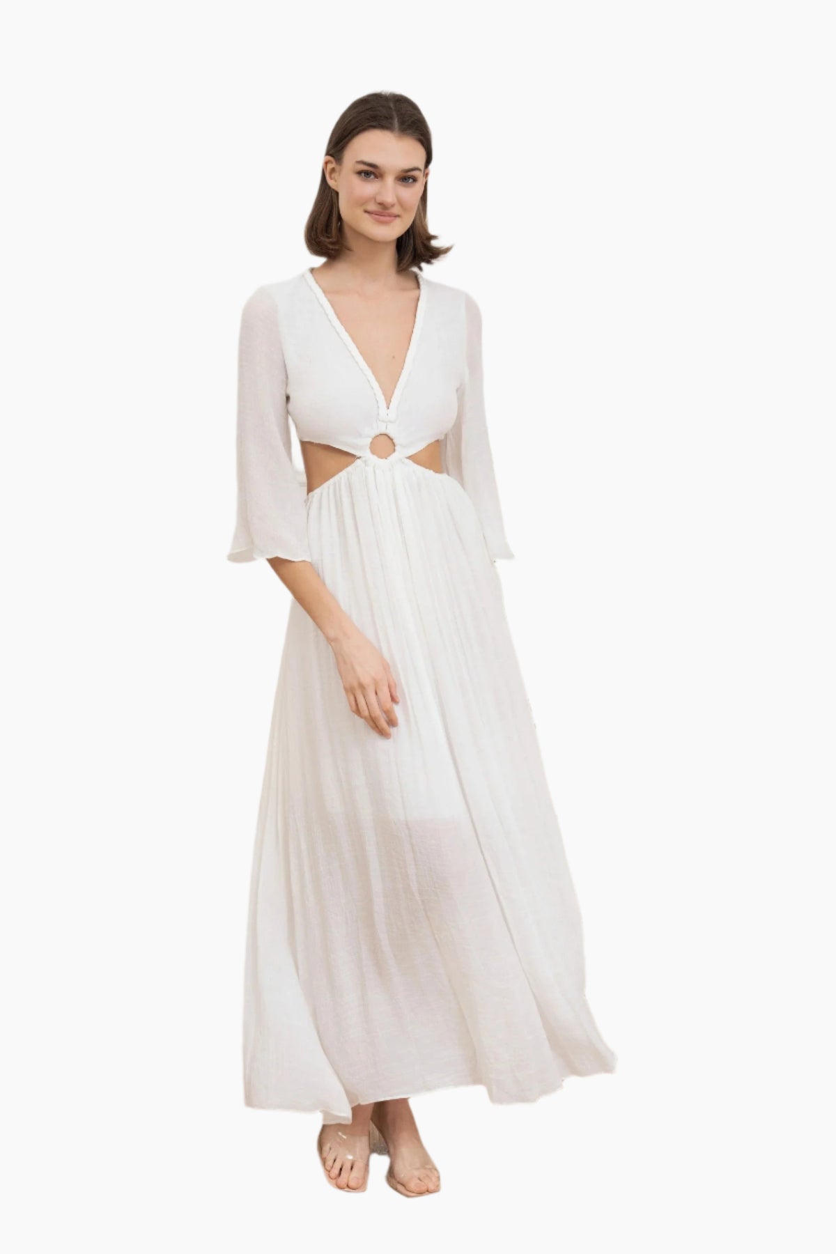 Woman wearing a white dress with cut-out design