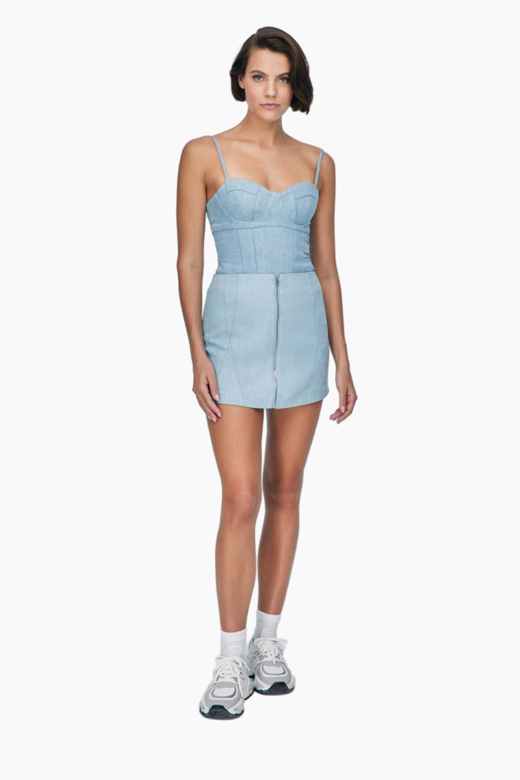 Woman wearing a nesta blue denim, this top feature sultry bustier neckline and chic corset shape, featuring a matching skirt
