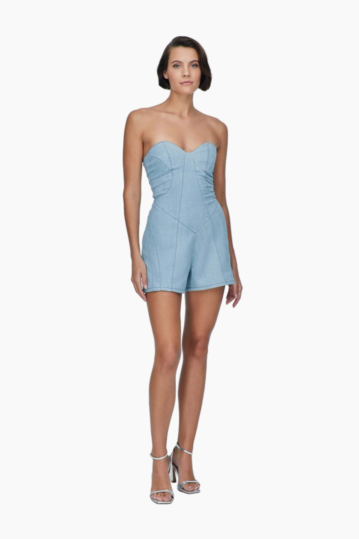 Woman wearing a light blue strapless romper
