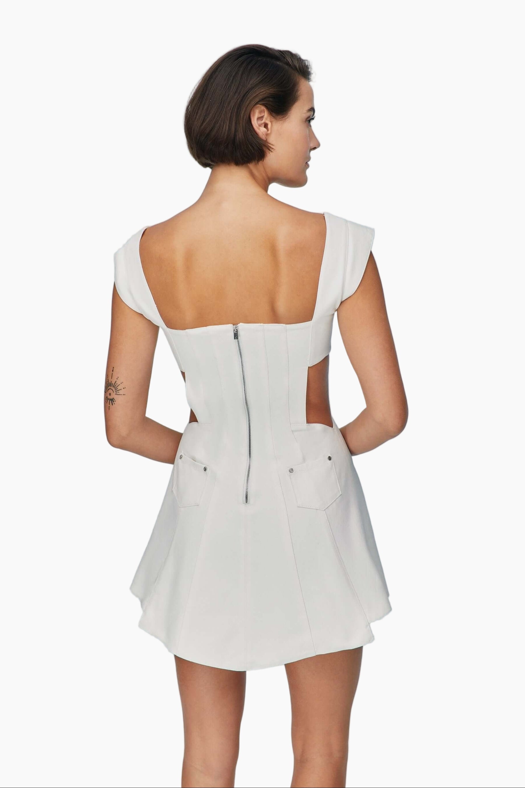 Woman wearing a white dress with cap sleeves