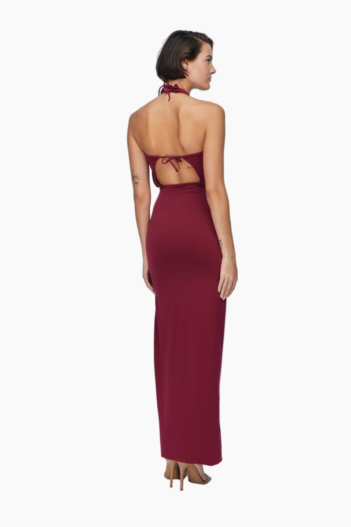 Woman wearing a burgundy halter neck gown
